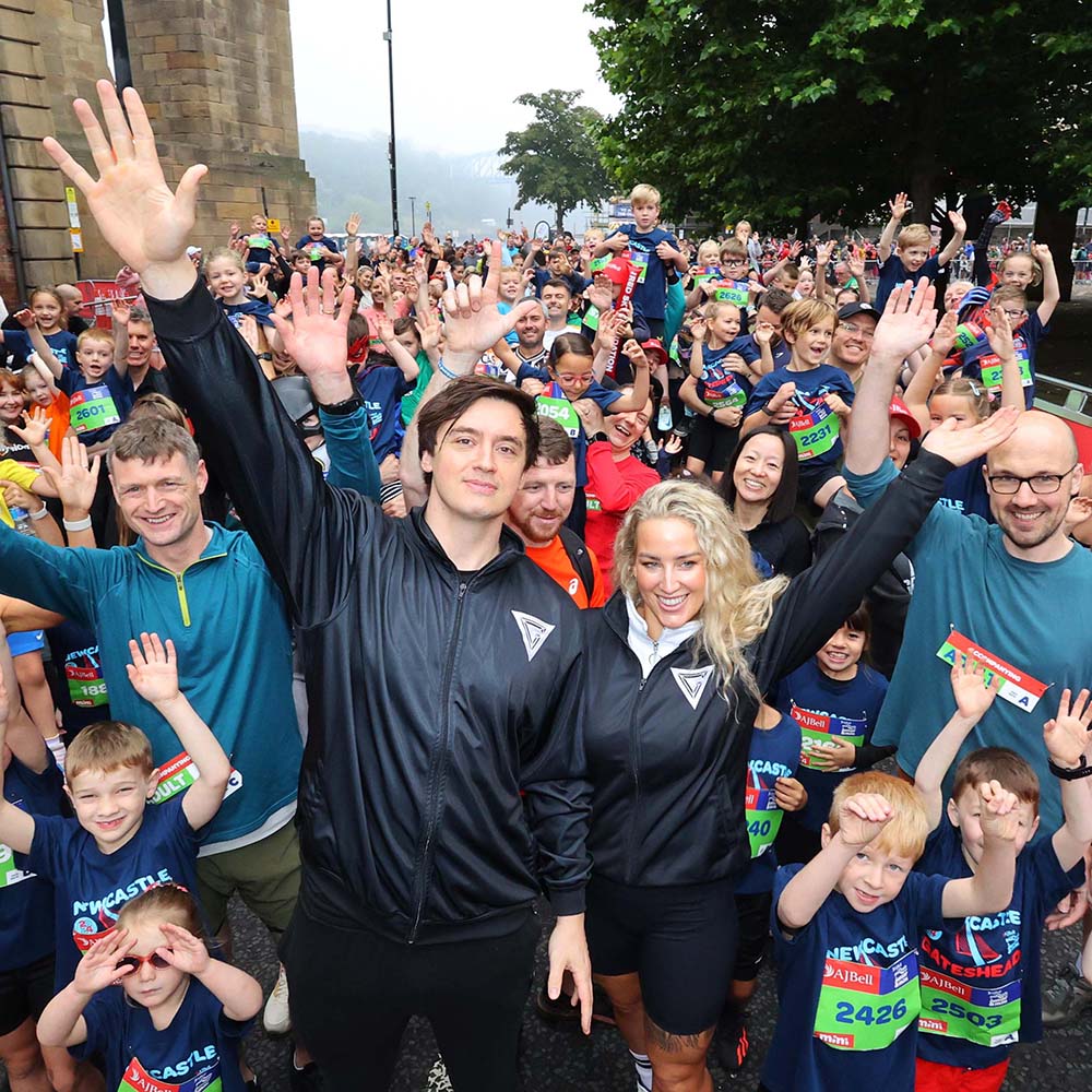 gladiators sabre and apollo with a crowd of young runners