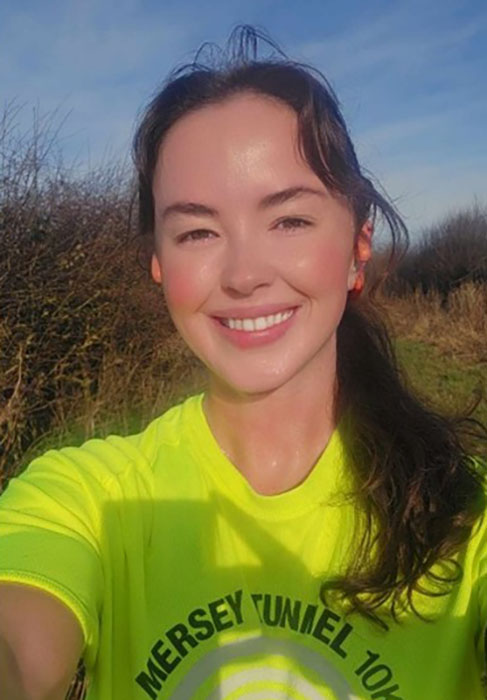 Image shows a smiling Mairead who is taking on the Great Manchester Run.